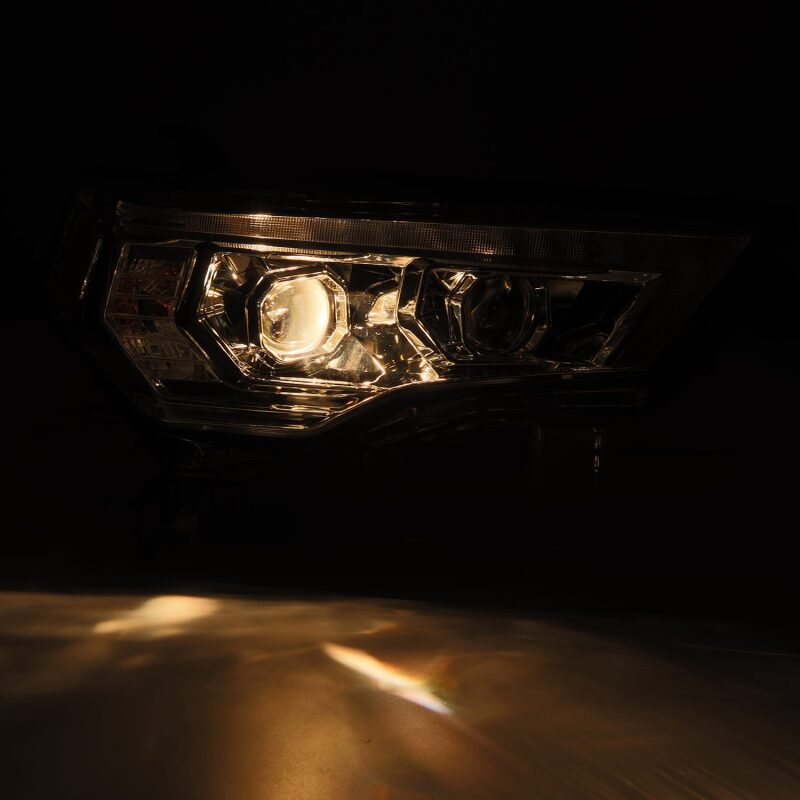 AlphaRex 14-22 Toyota 4Runner PRO-Series projector headlights in black with sequential signals and daytime running lights.