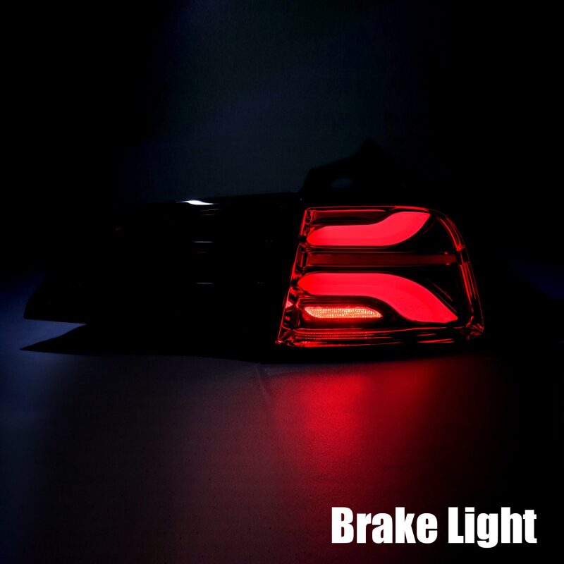 AlphaRex PRO-Series LED tail lights for 20-22 Tesla Model Y in jet black with sequential signals, showcasing the brake light.