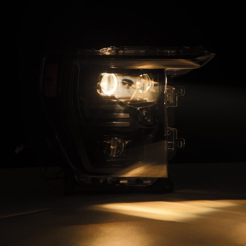 AlphaRex 21-22 Ford F150 PRO-Series projector headlights in black with sequential signal and active light features.