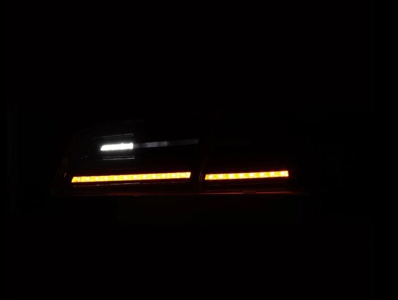 AlphaRex LUXX-Series LED tail lights for 12-21 Tesla Model S in black, featuring sleek design and bright illumination.