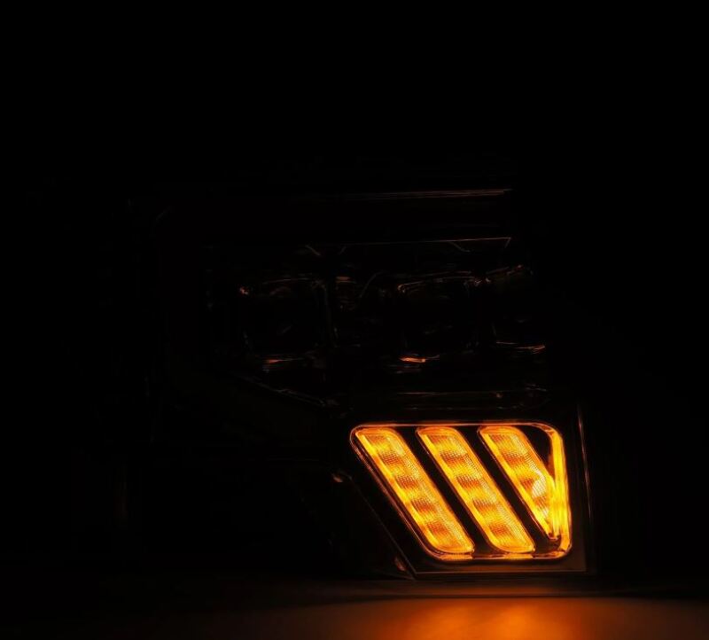 AlphaRex PRO-Series projector headlights for 09-14 Ford F-150 with plank style chrome and sequential signal lights.