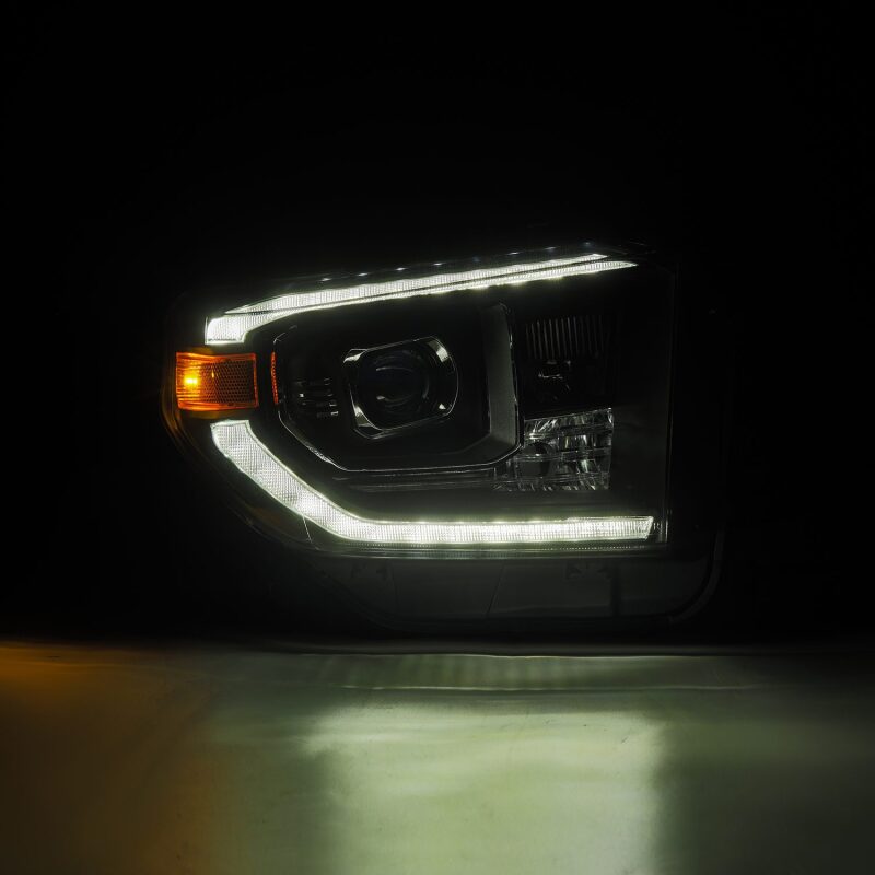 AlphaRex LUXX-Series LED projector headlights for 14-21 Toyota Tundra in black with active lighting and sequential signals.