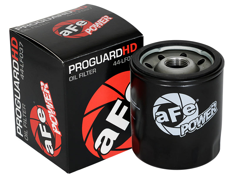 aFe PROGUARD oil filter displayed next to its packaging, designed for high-performance engine protection and filtration.