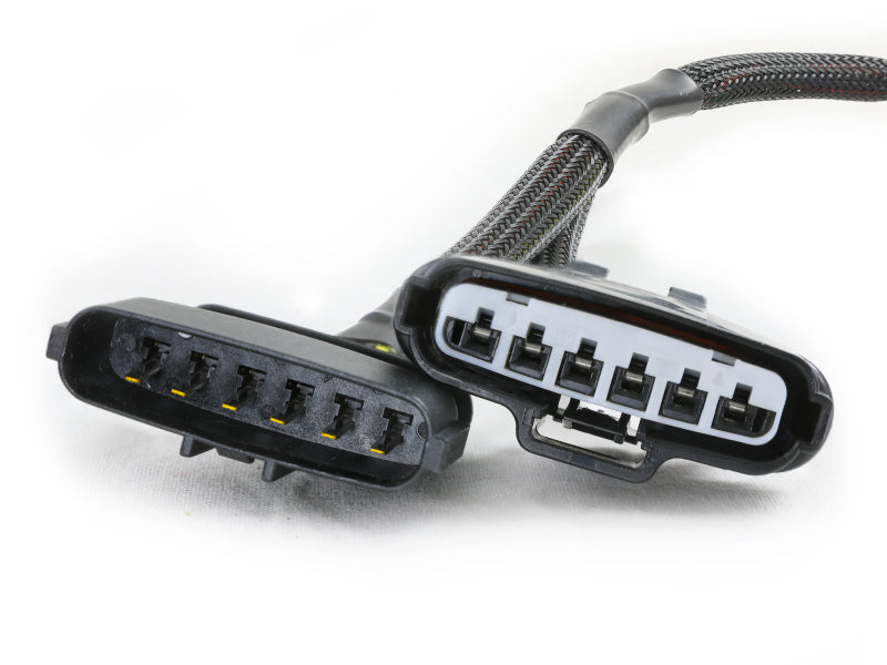 aFe 03-23 Toyota Tundra Pedal 2 Metal Throttle Enhancer connector with two plugs for improved throttle response.