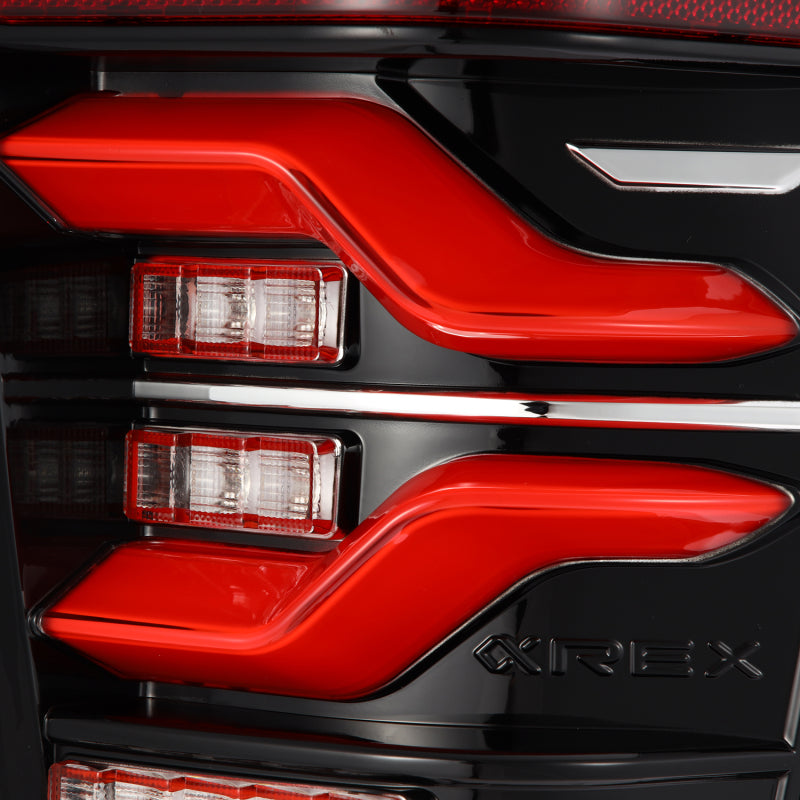 AlphaRex LUXX LED taillights for 2016-2021 Toyota Tacoma in black and red with sequential signal and activation light.