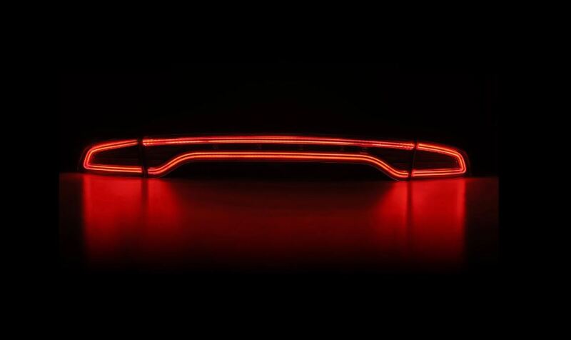 AlphaRex NOVA-Series prismatic LED tail lights for 2015-2023 Dodge Charger in black, showcasing a sleek red illumination design.