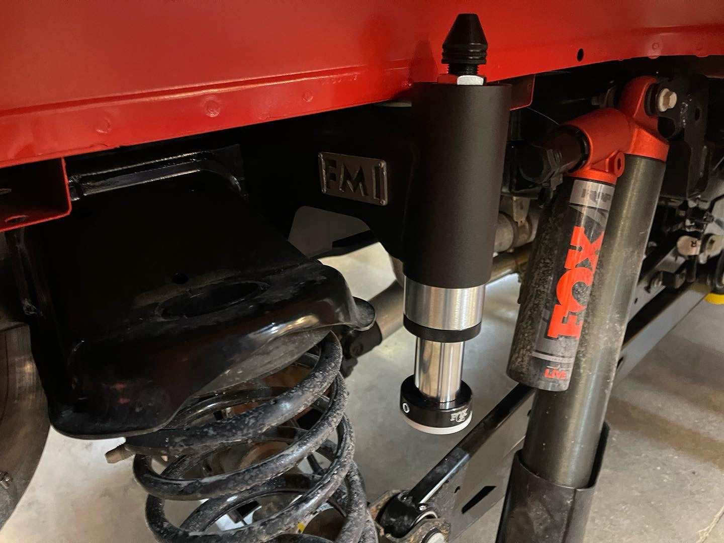2021 to 2024 Ford Raptor rear bump stop kit installed, showcasing high-performance components and suspension setup.