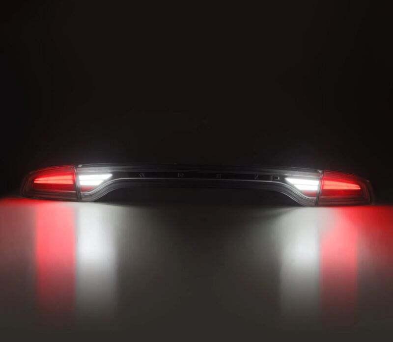AlphaRex NOVA-Series prismatic LED tail lights for 2015-2023 Dodge Charger in smoke finish, showcasing bright red and white illumination.
