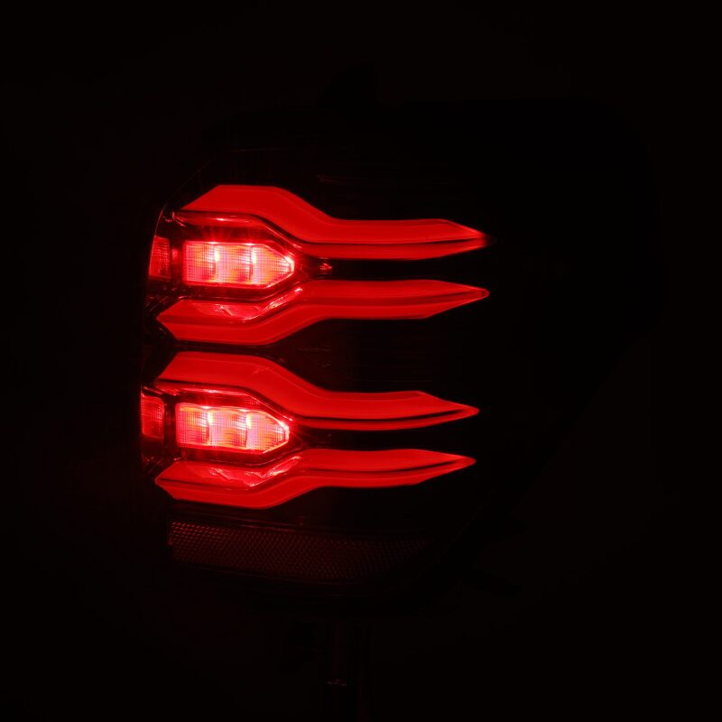 AlphaRex LUXX LED taillights for 10-21 Toyota 4Runner in black with sequential signal and active lighting features.
