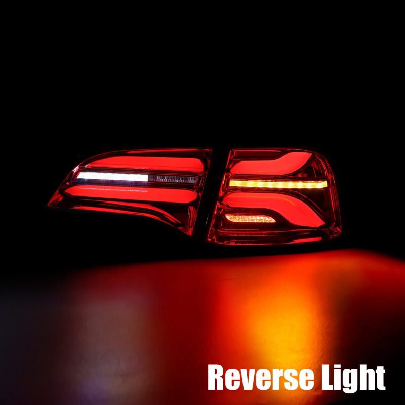 AlphaRex PRO-Series LED tail lights for 20-22 Tesla Model Y in red smoke with sequential signals. Enhanced visibility and style.