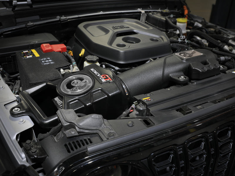 afe Momentum Sealed Intake system installed in a Jeep Wrangler 4xe engine bay, showcasing performance enhancement features.