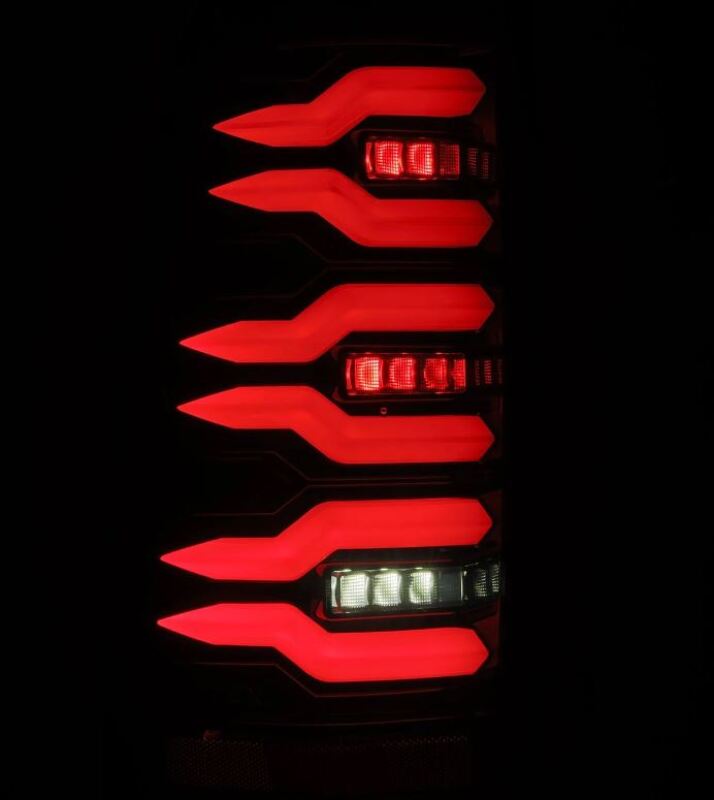 AlphaRex LUXX-Series LED tail lights for 99-06 Chevrolet Silverado Sierra in Alpha-Black with striking red and white illumination.