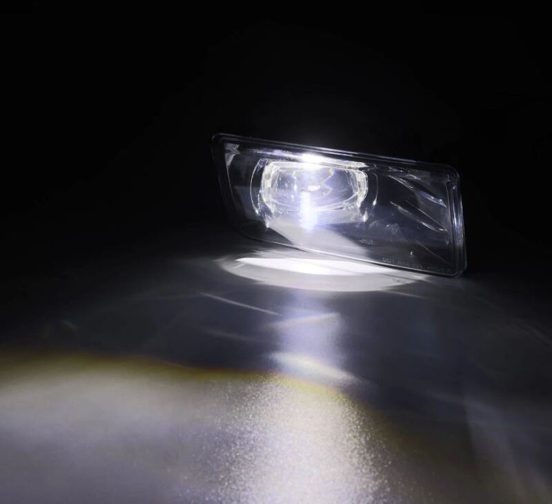 AlphaRex dual color LED projector fog lights for 07-13 Chevrolet Silverado and 04-17 Tahoe, showcasing bright white and amber light.