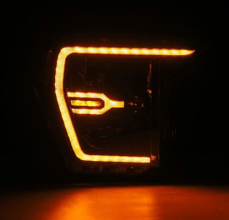 AlphaRex Luxx-Series projector headlights for 21-22 Ford F150 in alpha-black with sequential signal and active light features.