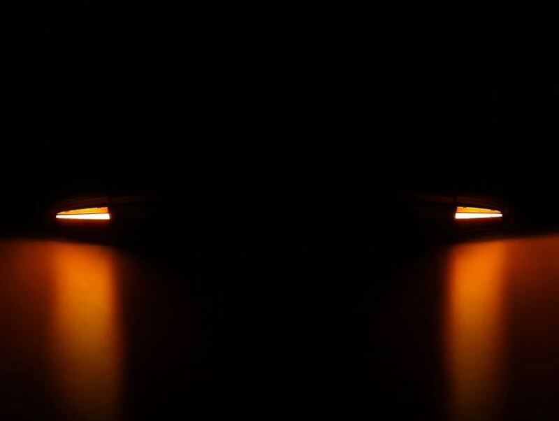 AlphaRex 15-23 Dodge Charger Nova-Series LED tail lights in Alpha-Black, showcasing sleek design with illuminated accents.