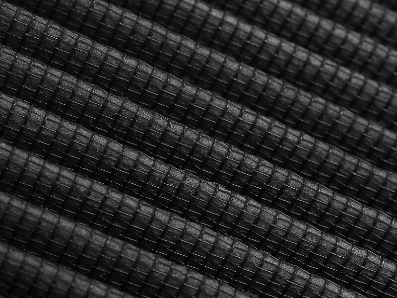 Close-up of the afe Track Series Intake Replacement Air Filter showcasing its textured black material and layered design.