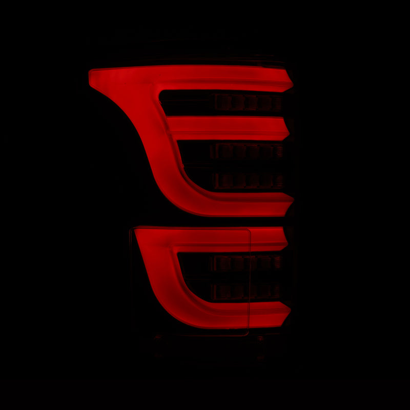 AlphaRex Luxx-Series LED tail lights for 2015-2020 Ford F150 in alpha-black with a sleek red illumination design.