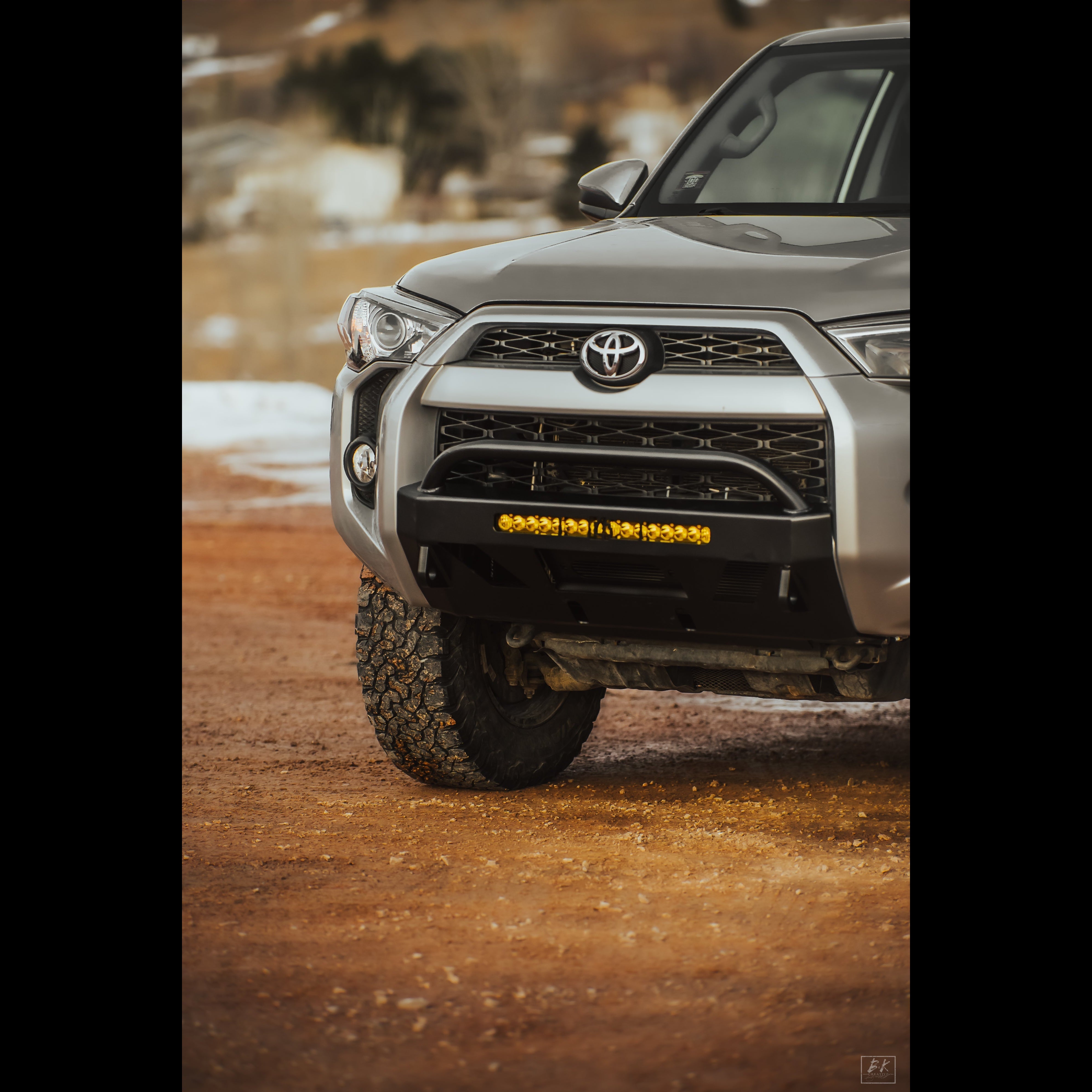 Lo-Pro winch bumper for 2014-2024 4Runner, featuring rugged design and integrated lighting for offroad performance.
