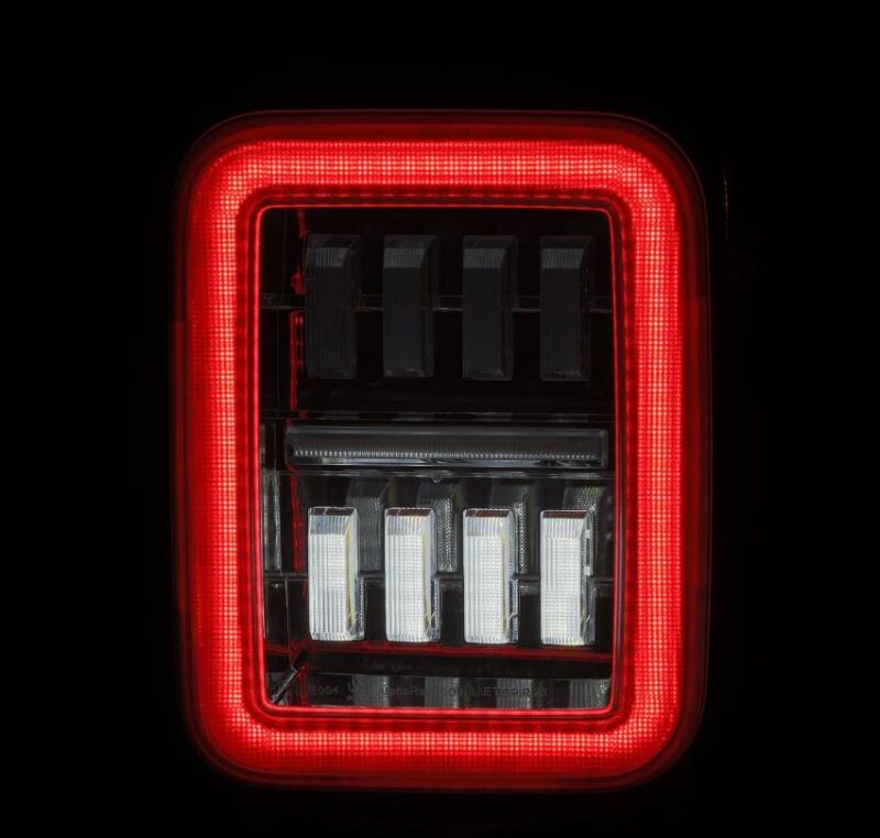 AlphaRex prismatic LED tail light for 19-24 Jeep Gladiator JT in chrome finish, showcasing bright red illumination.