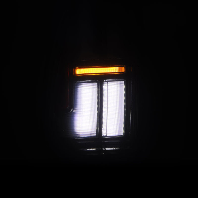 AlphaRex NOVA LED tail lights for 2005-2015 Toyota Tacoma in black, featuring bright white and amber lighting elements.