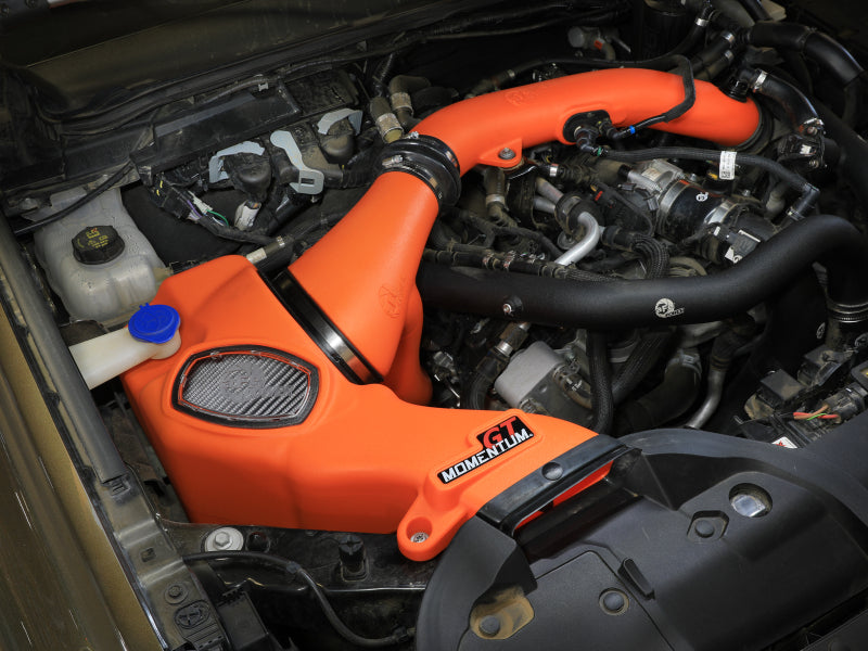 afe Momentum Sealed Intake for Ford Ranger Raptor 24-25 V6-3.0L showcasing an orange intake system in an engine bay.