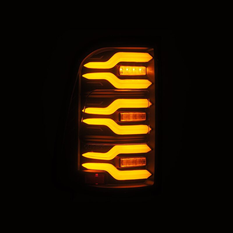 AlphaRex Luxx-Series LED tail lights for 19-21 Dodge Ram 1500 in black, featuring sequential signal and active lighting.