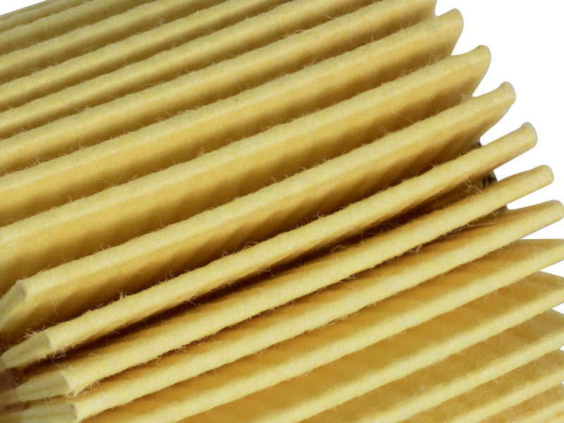 Close-up of the aFe ProGuard oil filter showcasing its pleated design for efficient filtration in vehicles.