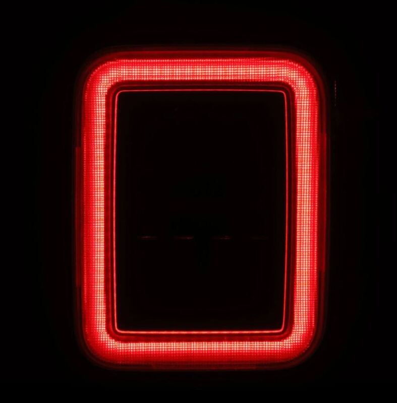 AlphaRex Jeep Gladiator JT Nova-Series prismatic LED tail light in alpha-black, featuring a sleek red illumination design.