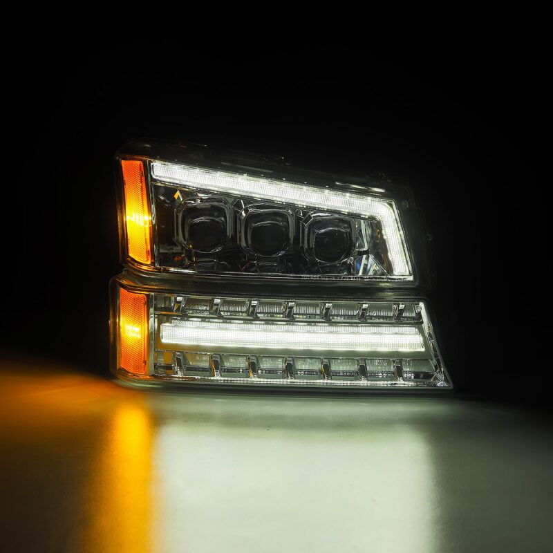 AlphaRex Chrome NOVA LED projector headlights for 03-06 Chevy Silverado and Avalanche, featuring bright LED accents.