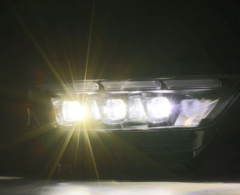 AlphaRex NOVA LED projector headlights for 15-17 Ford Mustang with black housing, sequential signals, and daytime running lights.