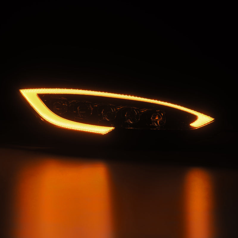 AlphaRex NOVA LED projector headlights for 12-21 Tesla Model S in black with sequential signals and daytime running lights.