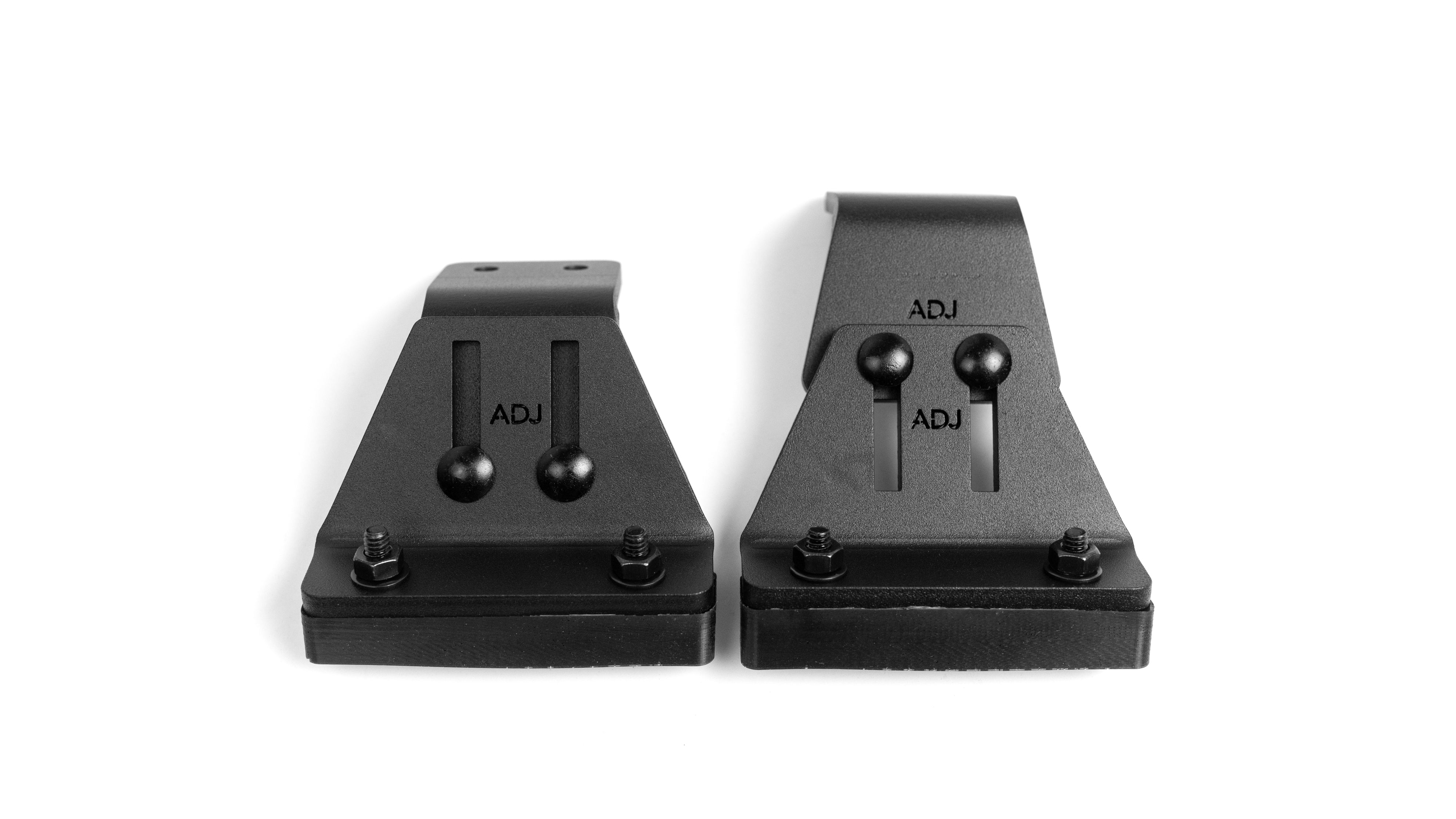 Adjustable leveling mounts for trucks and SUVs, featuring durable black metal construction and adjustable components.