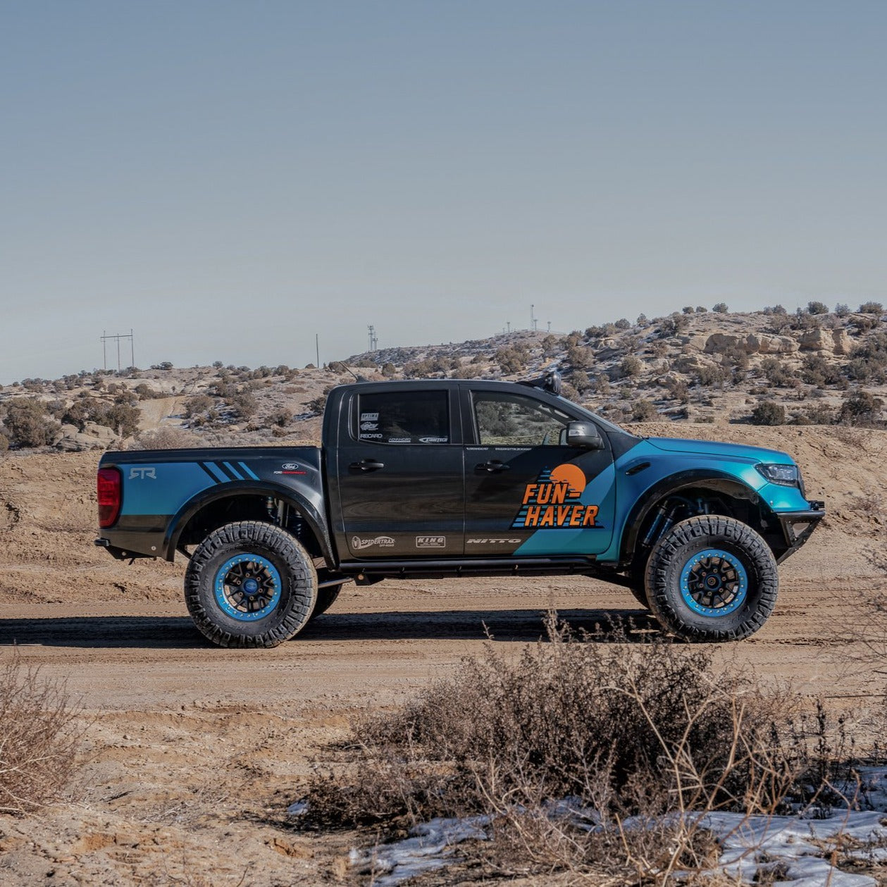 2019-2023 Ford Ranger with custom fenders, showcasing off-road capabilities in a desert landscape.