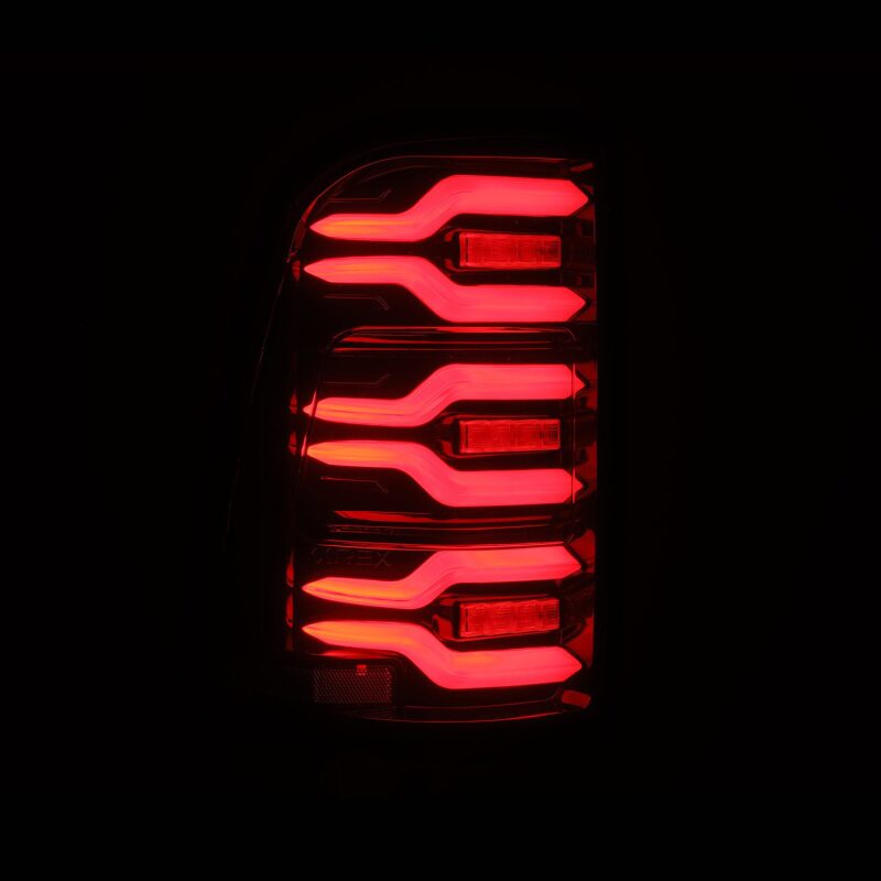 AlphaRex Luxx-Series LED tail lights for 19-21 Dodge Ram 1500 in black and red with sequential signals.