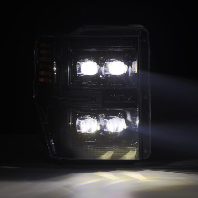 AlphaRex NOVA-Series LED projector headlights for 08-10 Ford F250-550, featuring black housing and sequential signals.