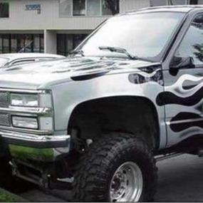 1988-1998 Chevrolet Silverado fenders showcasing a custom design on a modified truck with oversized tires.