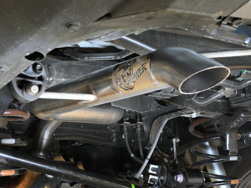 Afe Apollo GT Series axle-back exhaust system installed on a Toyota Land Cruiser, showcasing the polished stainless steel design and tubing.
