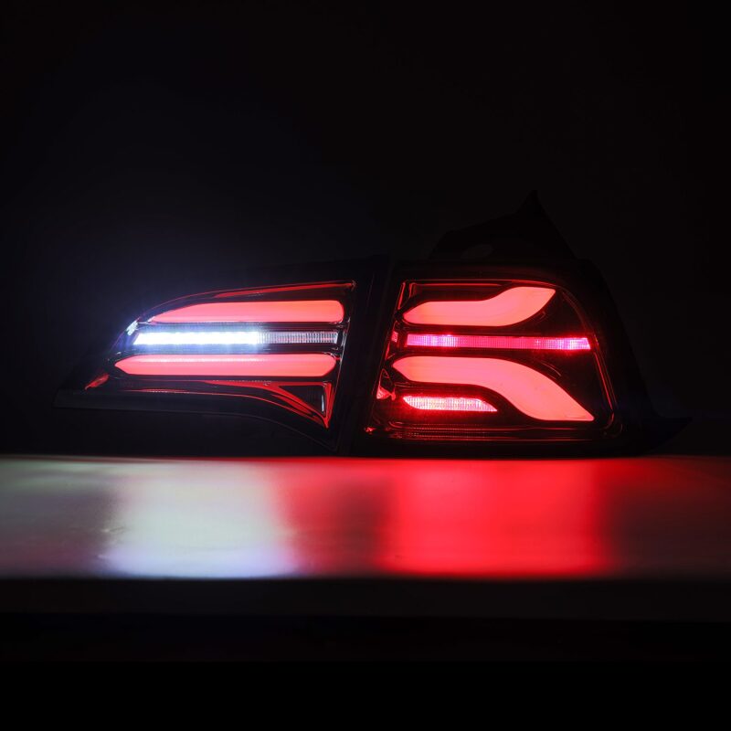 AlphaRex PRO-Series LED tail lights for 2017-2022 Tesla Model 3 in jet black with sequential signals.