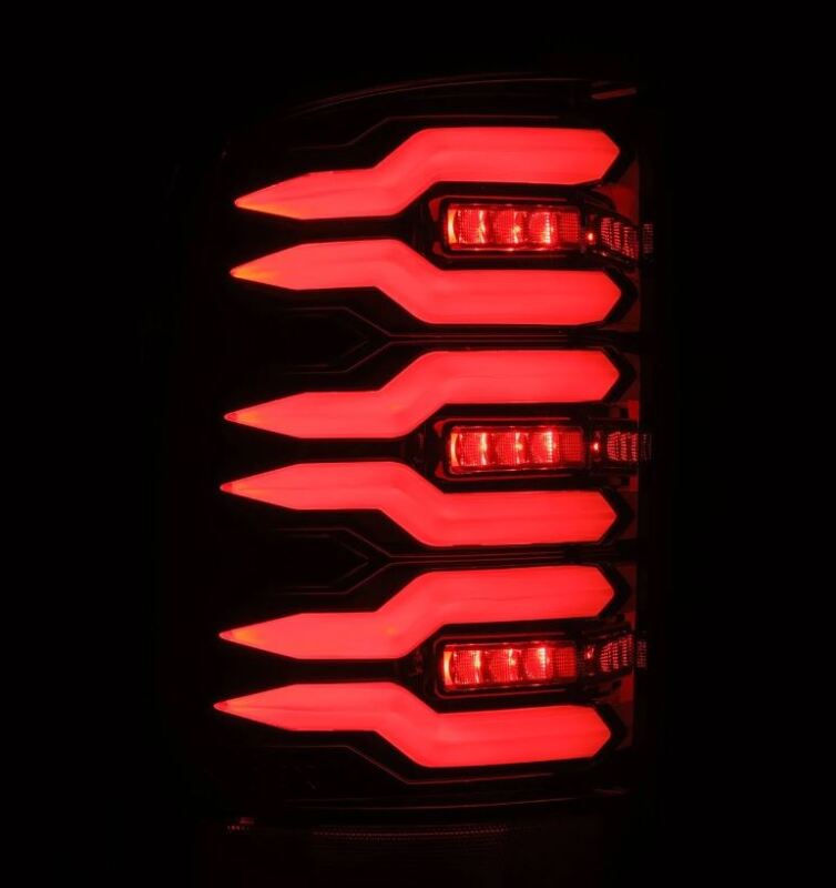 AlphaRex Luxx Series LED tail lights for 07-13 GMC Sierra, featuring a sleek black design and bright red illumination.