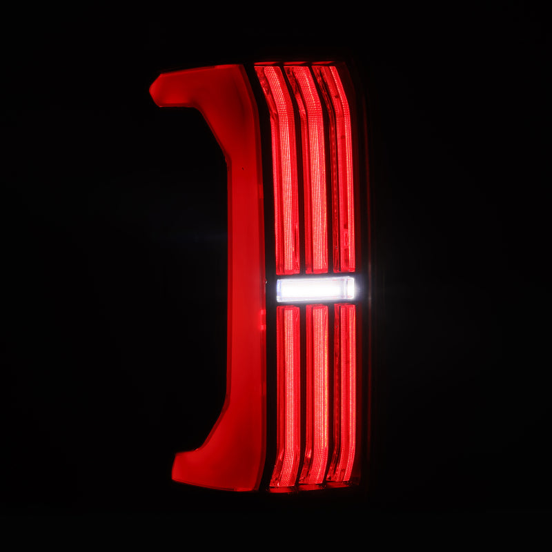 AlphaRex NOVA-Series LED prismatic tail light for 24-25 Toyota Tacoma in Alpha-Black finish, showcasing a sleek design.