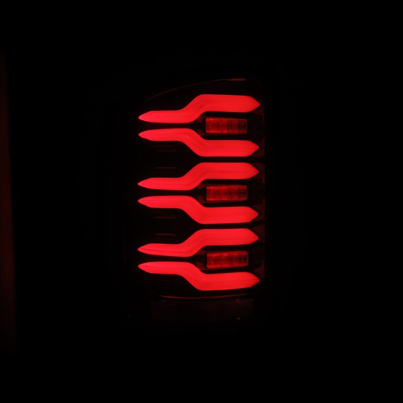 AlphaRex LUXX-Series LED tail lights for 14-18 GMC Sierra, featuring a sleek black and red design with sequential signals.