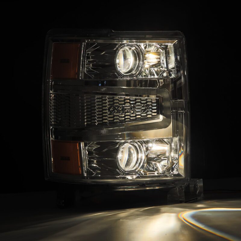 AlphaRex 14-15 Chevy 1500 PRO-Series projector headlights in chrome with sequential signal and daytime running lights.