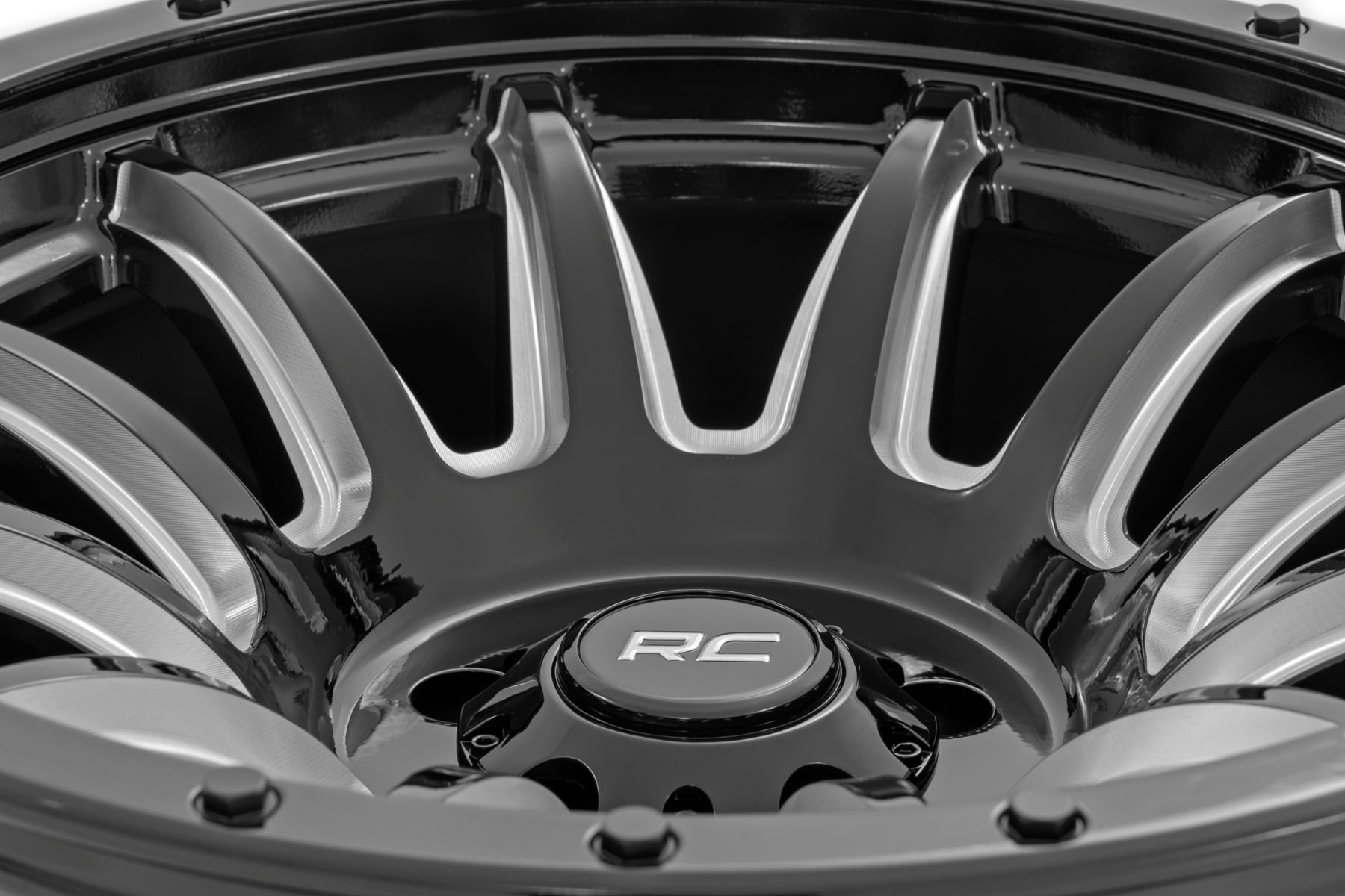 90 Series Wheel One-Piece Gloss Black w/machined spokes 18x9 6x5.5 -12mm Rough Country