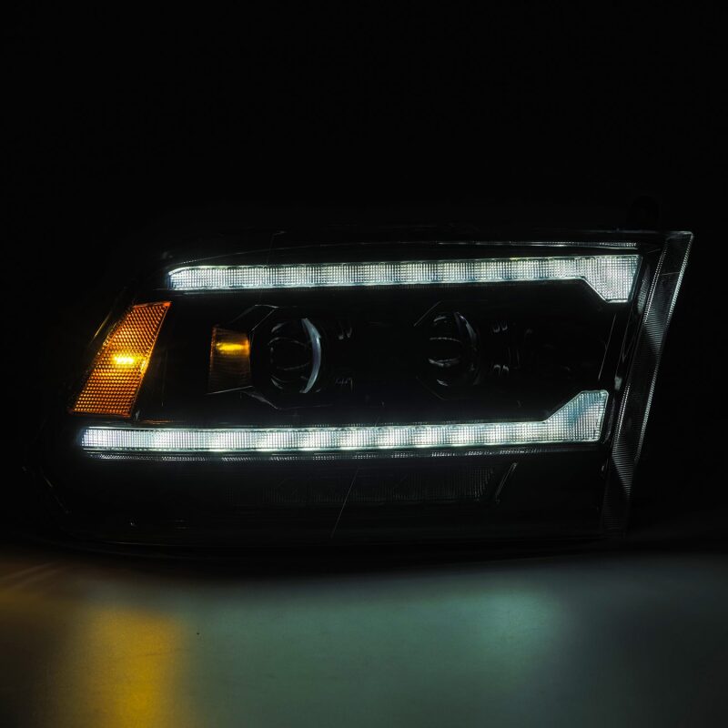 AlphaRex PRO-Series projector headlights for 09-18 RAM 1500 in alpha-black with sequential signals and DRL.