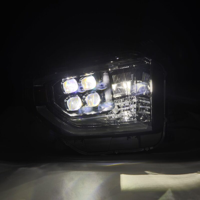 AlphaRex NOVA-Series LED projector headlights for 14-21 Toyota Tundra in black, featuring active light, sequential signals, and DRL.