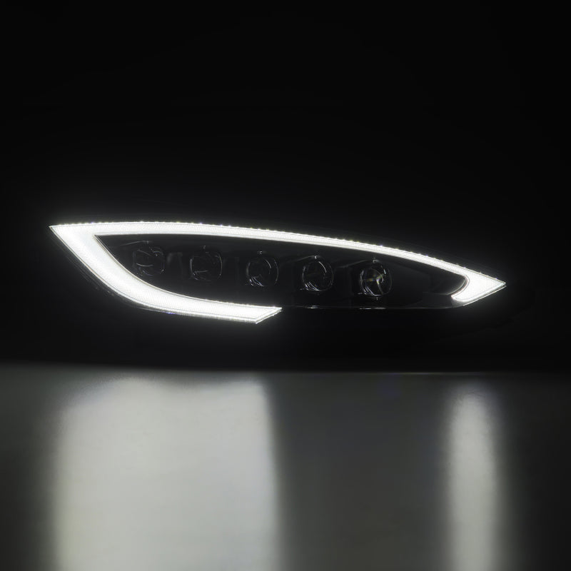 AlphaRex NOVA-Series LED projector headlights for 12-21 Tesla Model S with black housing, sequential signals, and daytime running lights.