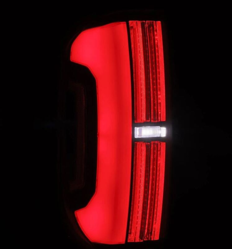 AlphaRex Nova-Series LED tail lights for 14-21 Toyota Tundra in black and red, showcasing a modern design and bright illumination.