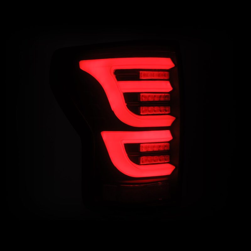AlphaRex LUXX-Series LED tail lights for 2007-2013 Toyota Tundra in black, featuring a sleek design and bright red illumination.