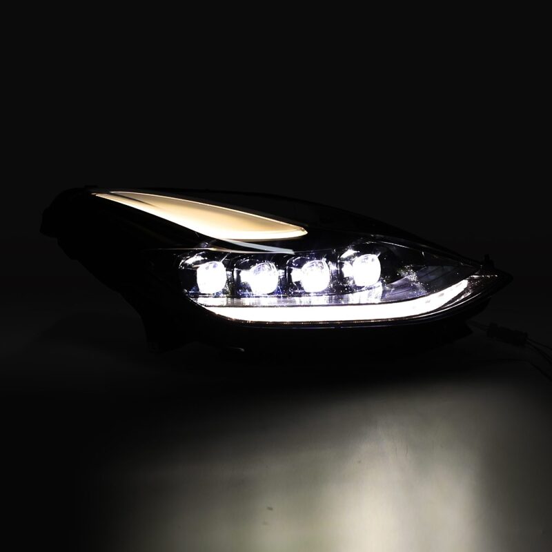 AlphaRex NOVA LED projector headlights for 17-22 Tesla Model 3 and 20-23 Model Y, featuring a sleek black design with active lighting and sequential signals.