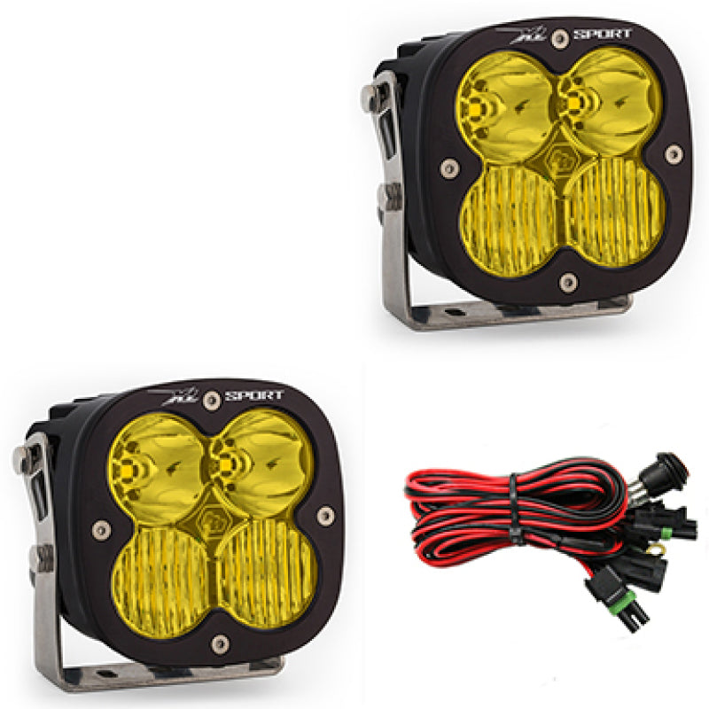 Baja Designs XL Sport Series amber LED light pods with driving combo pattern, featuring durable housing and wiring harness.